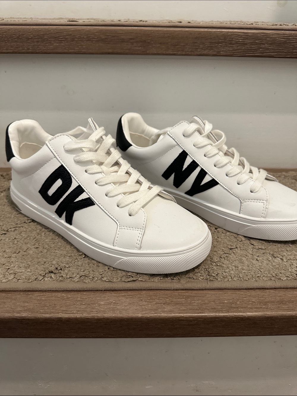 DKNY White Sneakers with Black Heel Accent and Silver Trim